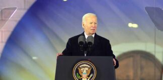 Biden Pardon Hits Wall In Congress man at presidential podium delivering a speech