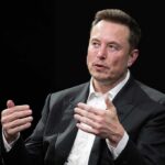 Economist Clash: Musk Flips The Label man in a suit speaking with hand gestures