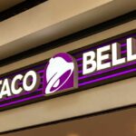 Taco Bell Faces Parasite Outbreak Questions Taco Bell storefront sign with purple bell logo
