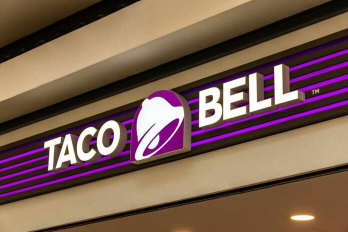 Lisbon,,Portugal.,11,December,2023.,Taco,Bell,Logo,Sign,At Taco Bell storefront sign with purple bell logo