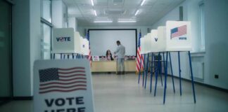 California Recruits Teen Poll Workers Interior of a polling station with voting booths and officials