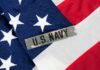 Pentagon Patch Gamble Sparks Safety Jitters Close-up of an American flag with a U.S. Navy insignia