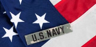 Pentagon Patch Gamble Sparks Safety Jitters Close-up of an American flag with a U.S. Navy insignia