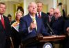 Lindsey Graham Dies Suddenly At 71 A group of government officials at a press conference with one speaking into a microphone