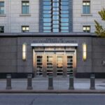 New Embassy Deal Faces Land Claims Entrance of the United States Embassy with modern architecture