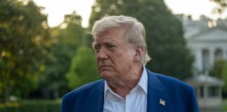 Online Threats Turn Into Federal Charges A political figure with a serious expression standing outdoors near the White House