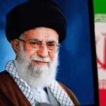 Tehran Stages Historic State Funeral Portrait of a political leader with a black turban and glasses