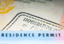 Trump Tightens Student Visa Rules Residence permit document with immigration stamp