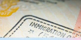 Trump Tightens Student Visa Rules Residence permit document with immigration stamp