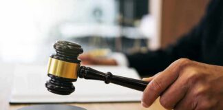 Attorney General Blasts ‘Extreme’ Family Abuse Judge's hand holding a gavel over a sound block