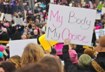 The Abortion Debate Just Got More Complicated Protesters hold signs at a crowded march
