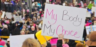 The Abortion Debate Just Got More Complicated Protesters hold signs at a crowded march