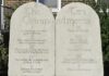 Nine–Eight Ruling Ignites Religion Fight Stone tablets of the Ten Commandments outside a building
