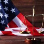Massive Medicaid Grift Erupts In Pennsylvania golden balance scale in front of an American flag