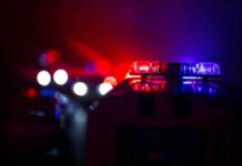 TikTok Chaos: Cops Swarm Celebrity Home Police car light bar flashing red and blue at night