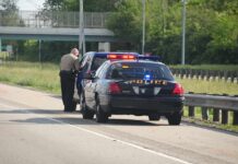 Traffic Stop Exposes Grisly Ride Police officer conducting a traffic stop on a highway