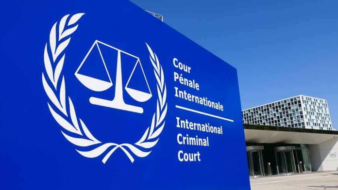 International Criminal Court sign with scales emblem outside modern building