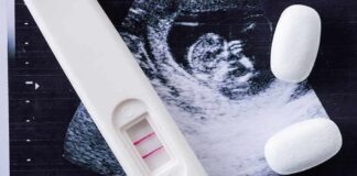 Justice Department Eyes Abortion Restrictions Pregnancy test with two lines on an ultrasound print