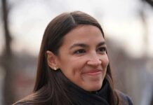 AOC Sends Her Biggest 2028 Signal woman smiling in an outdoor close-up portrait