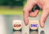 Hand choosing between GOP and DNC dice