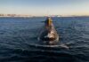 Two Allied Nuclear Subs Nearly Collided Submarine cruising on cold open water toward camera