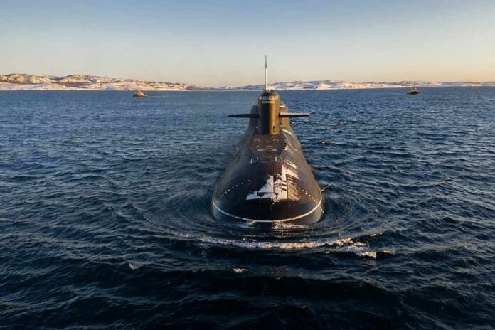Submarine cruising on cold open water toward camera