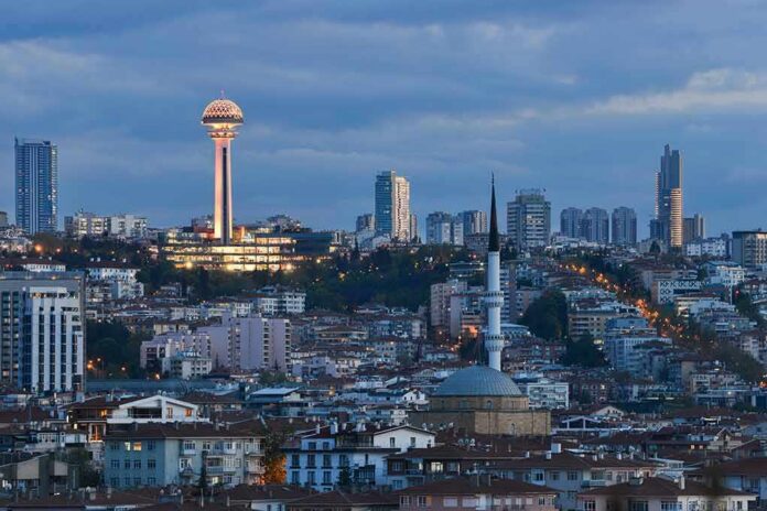 Ankara skyline at dusk with Atakule tower and a mosque