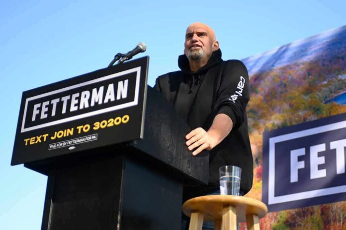 Speaker at outdoor rally standing at podium with microphone