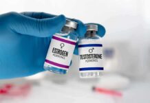 Nationwide Block: Puberty Drugs Defunded Gloved hand holding estrogen and testosterone vials