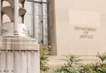 Department of Justice building facade with stone sign and window