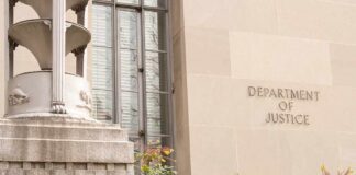 Department of Justice building facade with stone sign and window