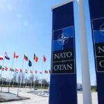 NATO flags and banners outside headquarters