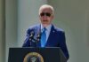 Painful Turn For Biden Stuns Allies man in blue suit speaking at a podium with presidential seal