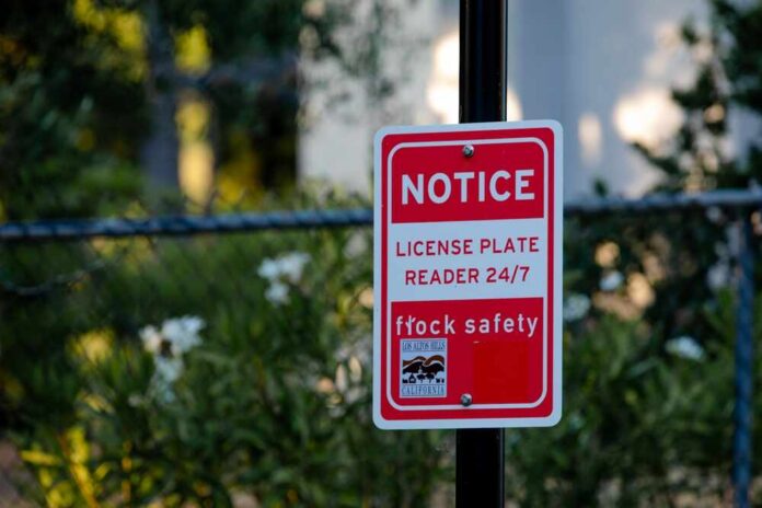 Los,Altos,Hills,,Ca,Us,-,June,14,,2025:,A Red notice sign on a black pole in a leafy outdoor area