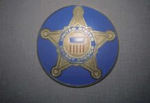 United States Secret Service badge emblem on blue background