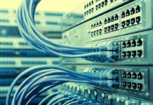 Massive Emissions Ceiling Triggers National Fight Network switches with blue Ethernet cables