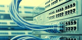 Massive Emissions Ceiling Triggers National Fight Network switches with blue Ethernet cables