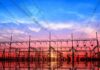 Electrical substation with power lines at sunset