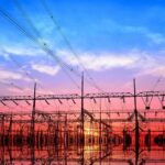 Electrical substation with power lines at sunset