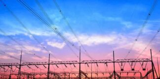 Electrical substation with power lines at sunset
