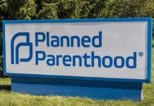 Funding Shortfall Forces Clinic Closures Planned Parenthood outdoor sign with blue logo