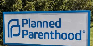 Funding Shortfall Forces Clinic Closures Planned Parenthood outdoor sign with blue logo