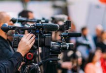 Feminist Icon Gloria Steinem Dies At 92 Video cameras on tripods at a media event