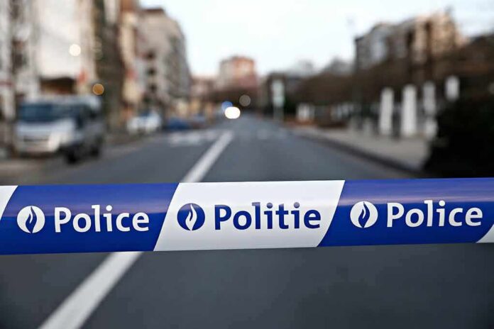shutterstock_1047491764 Police tape blocks a city street