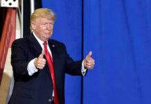 Dance Ends, Game Begins in North Carolina man in suit giving two thumbs up