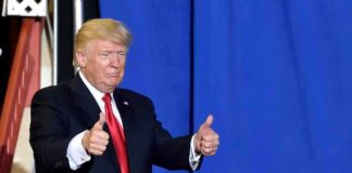 Dance Ends, Game Begins in North Carolina man in suit giving two thumbs up