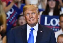 Diesel Panic: Trump Pressures Zelenskiy man in suit and blue tie at a crowded event