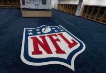 NFL logo on the floor of an empty locker room