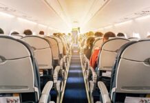 Duct-Taped Chaos at 35,000 Feet airplane cabin with passengers seated in economy class
