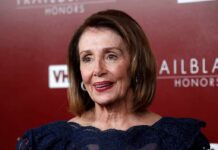 Pelosi’s Latest Stock Disclosure Raises Questions woman in navy lace dress on red carpet